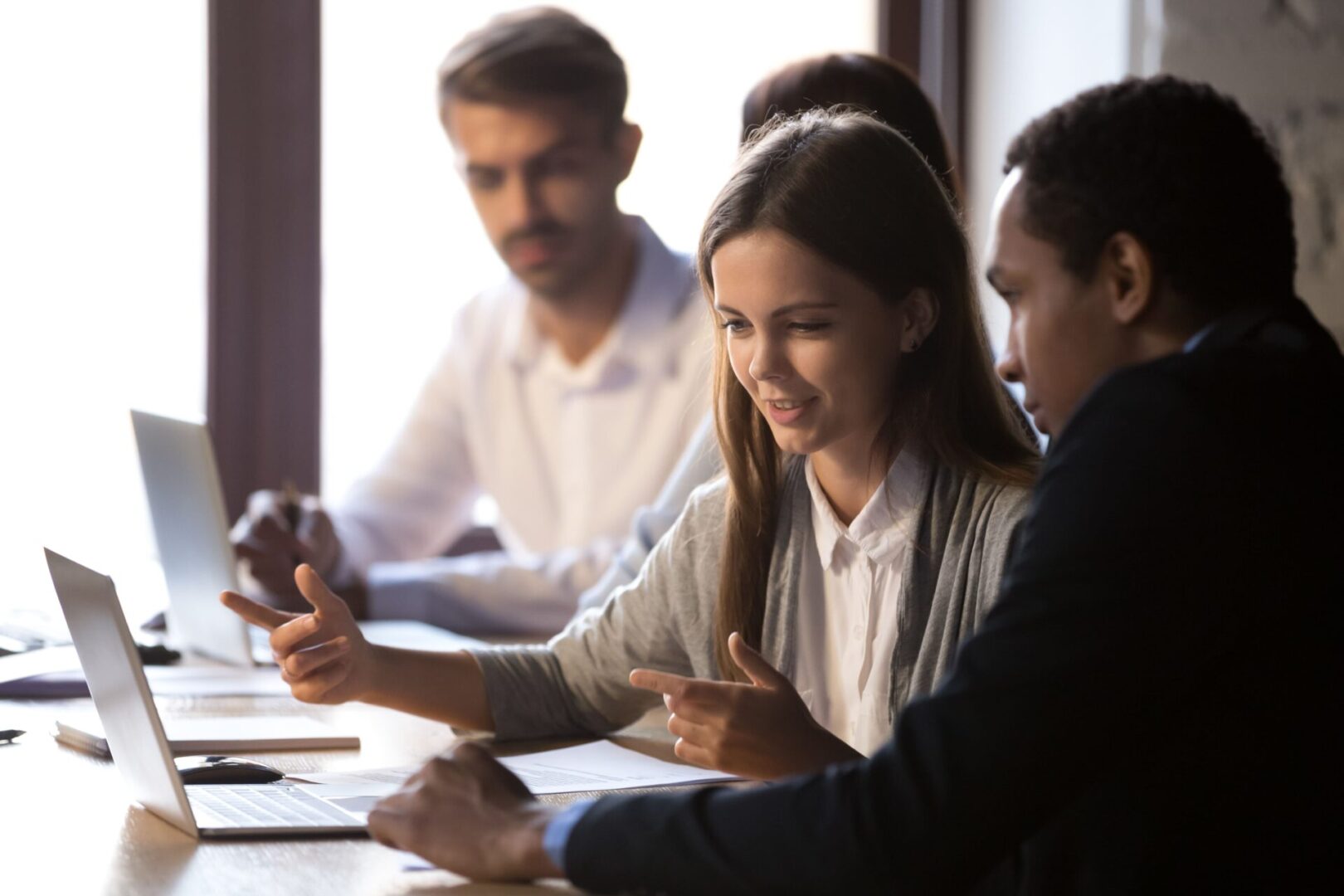 A group of people sitting at a table.