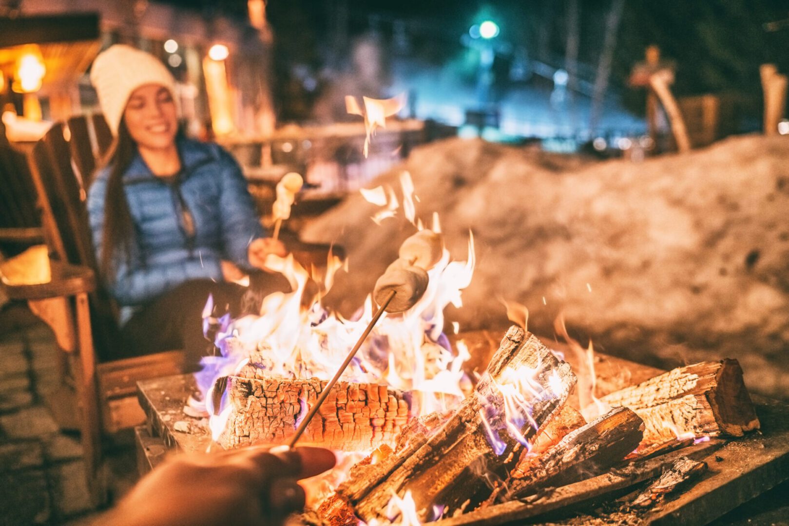 A person sitting in front of some fire