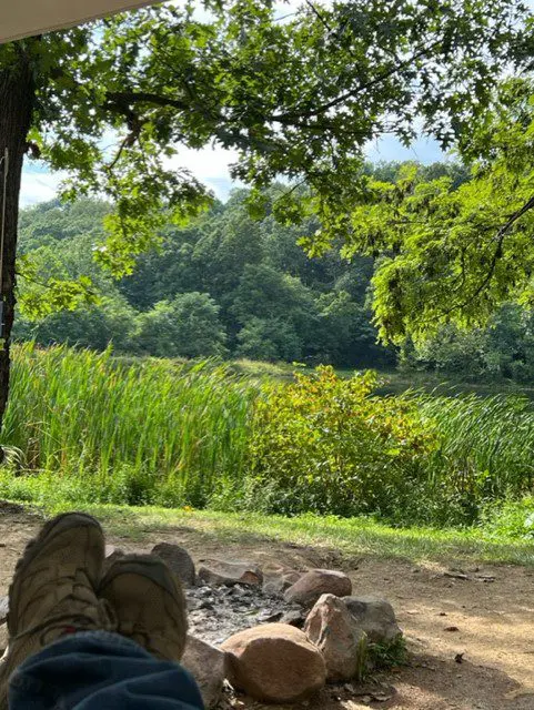 A person sitting near the cove campground