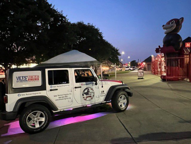 White Jeep with Vets Retreat Virginia logo.