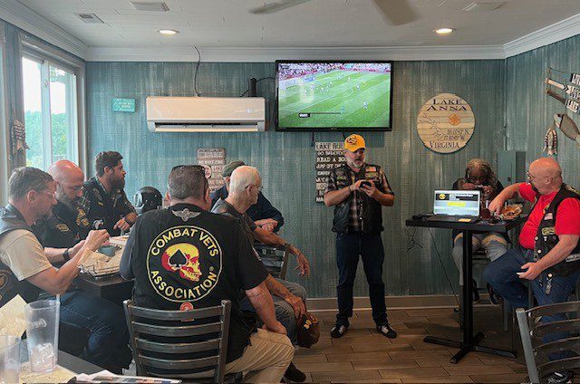 Veterans meeting at a lakefront restaurant.